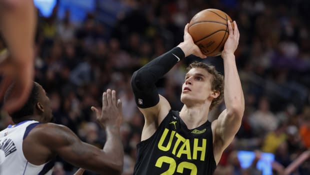 Utah Jazz forward Lauri Markkanen (23) shoots the ball over Dallas Mavericks forward Dorian Finney-Smith (10) during the second half at Vivint Arena.